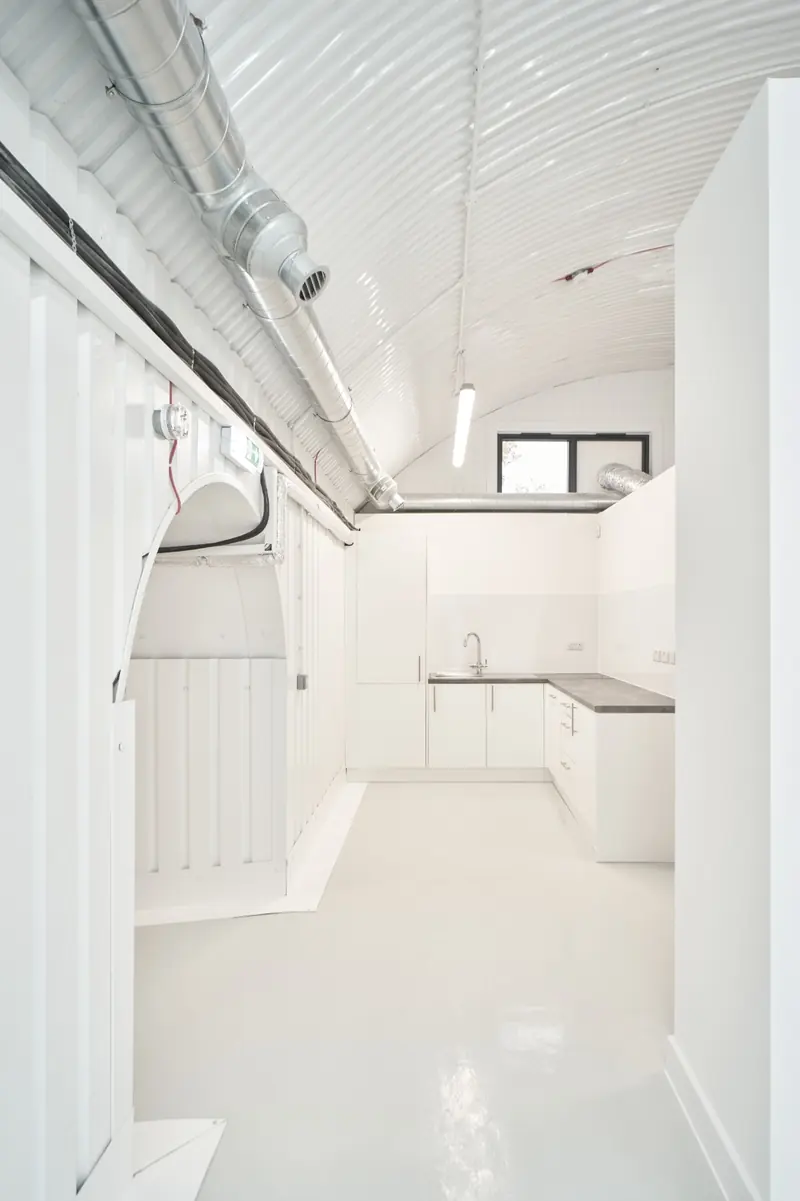 Kitchenette inside a white converted railway arch