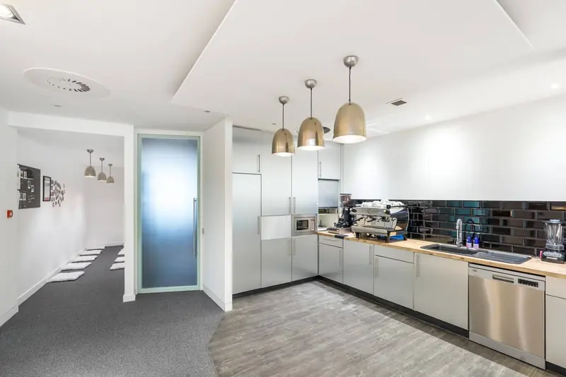 Office kitchen with pendant lights