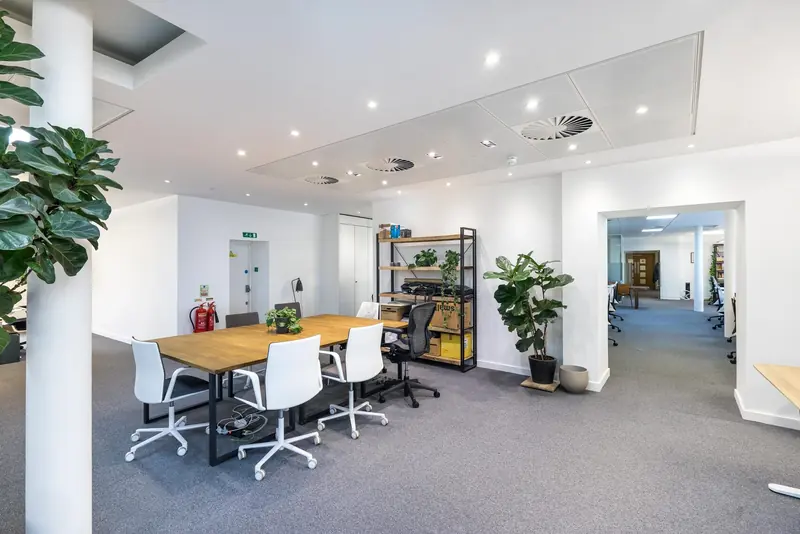 Open-plan office with white desks after a Craftex fit-out