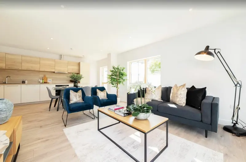 Refurbished flat living room with open-plan kitchen