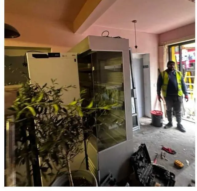 Restaurant fit-out in progress with an operative on site