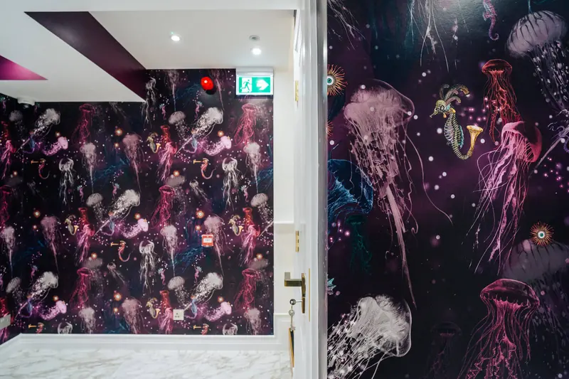 Salon corridor with dark jellyfish wallpaper