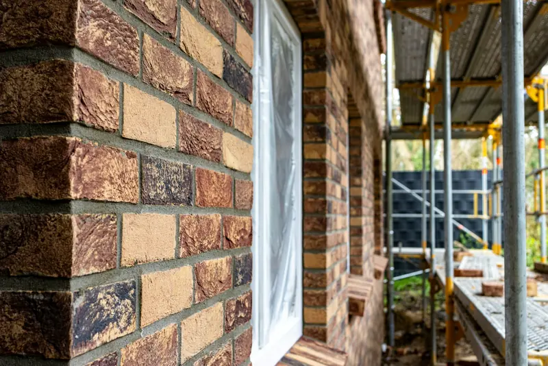 Brick building with scaffold on the side