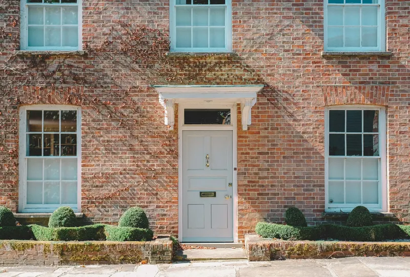 Brick house with a white front door