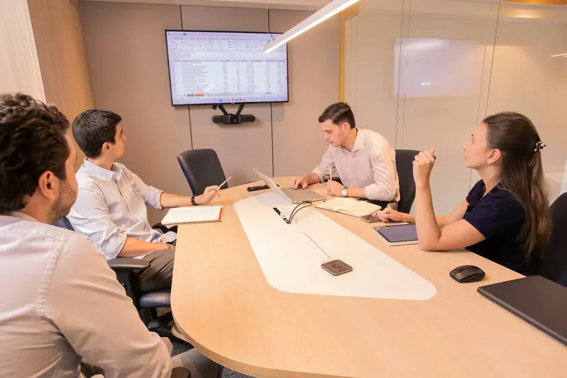 Business meeting around a conference table