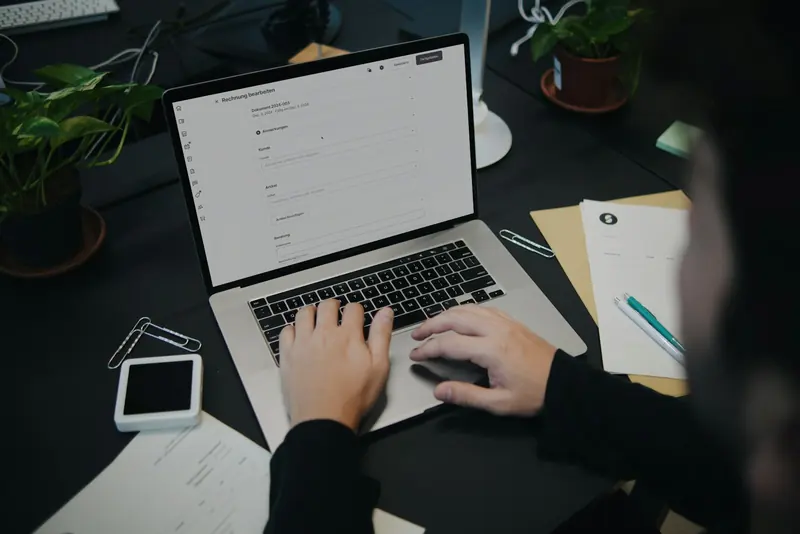 Business owner working through documents at a desk