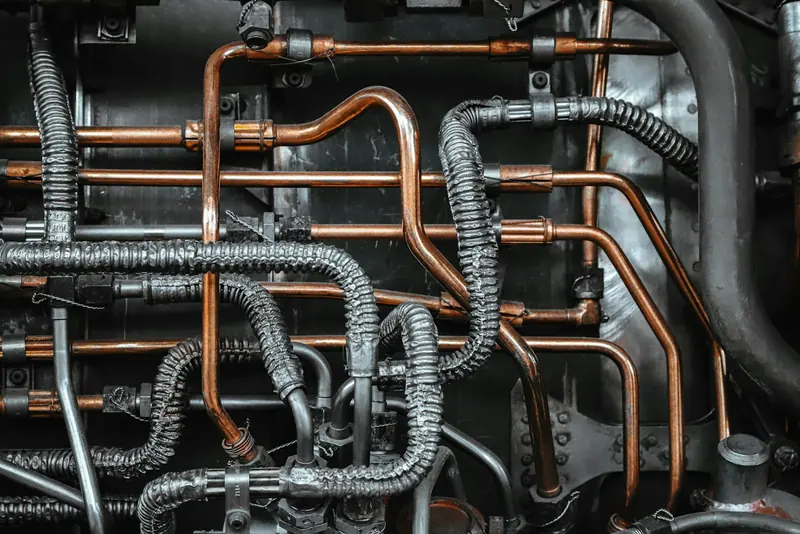 Copper and flexible pipework behind a heating system