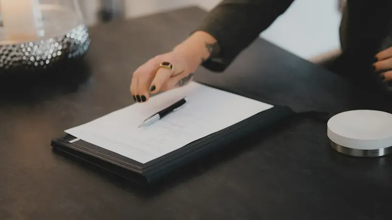 Document and pen on a clipboard ready for signature