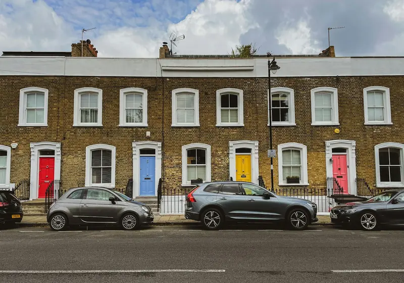 Georgian brick terrace with coloured front doors