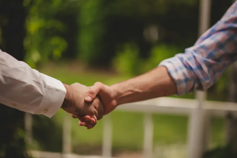 Handshake on a garden terrace