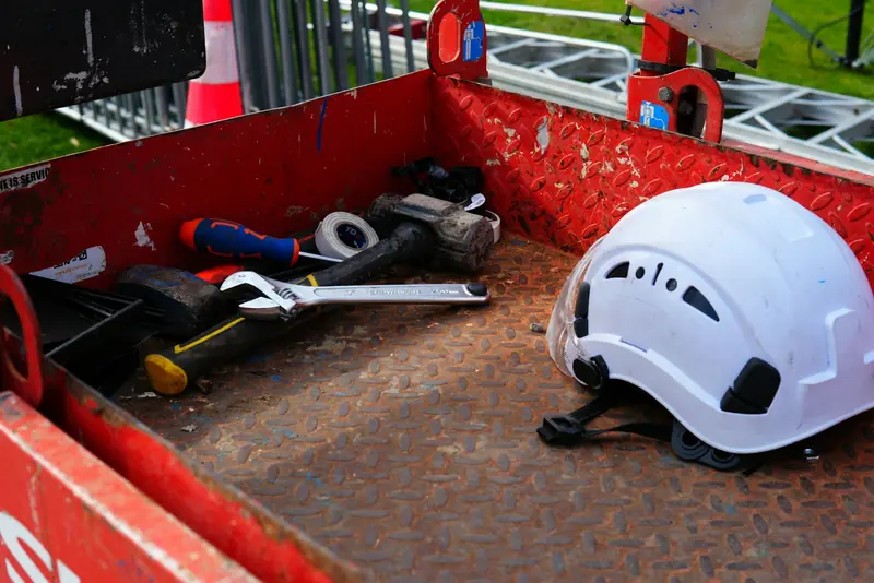 Hard hat and tools in a red site box