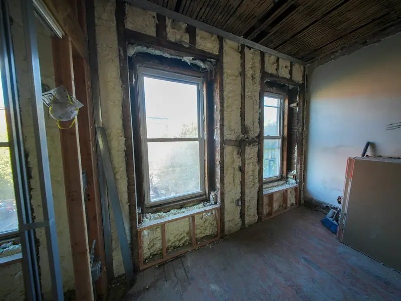 Insulated stud walls around windows during a house renovation