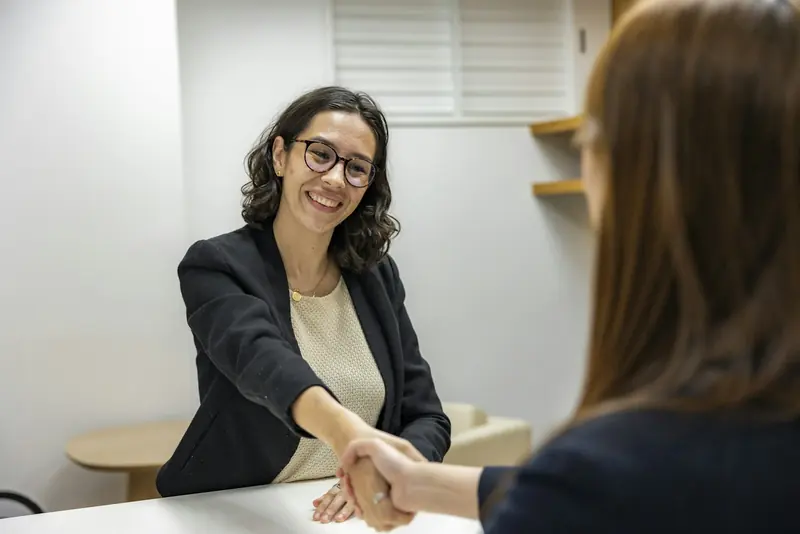 Interviewer shaking hands with a candidate