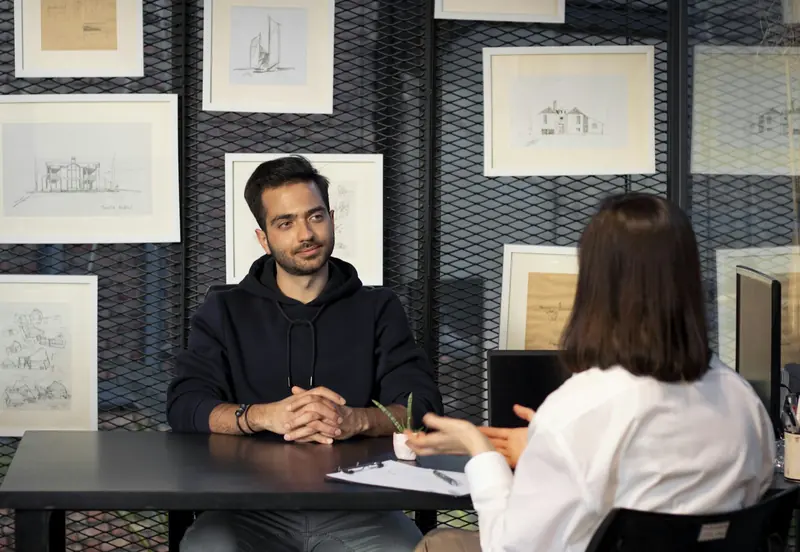 Job interview at a desk in a design office