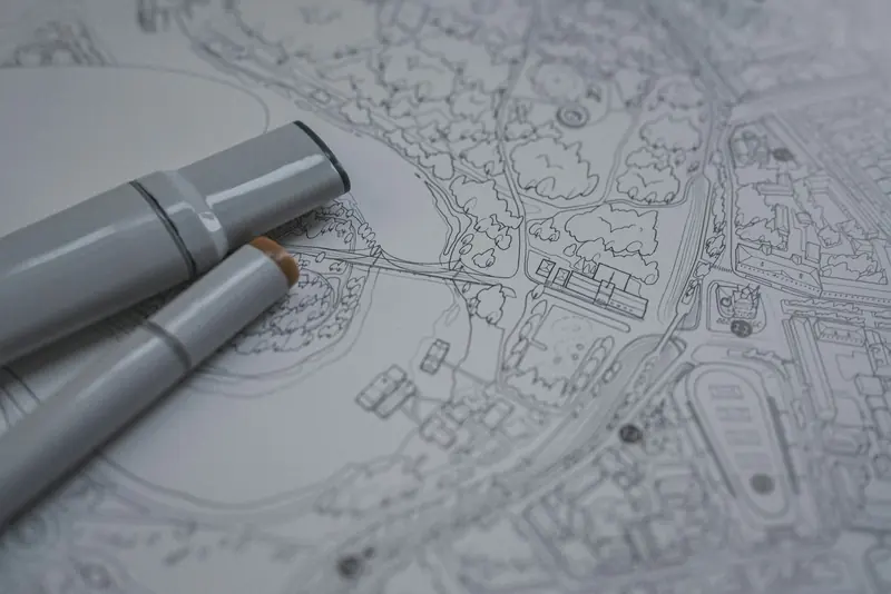 Marker pens resting on a detailed site plan