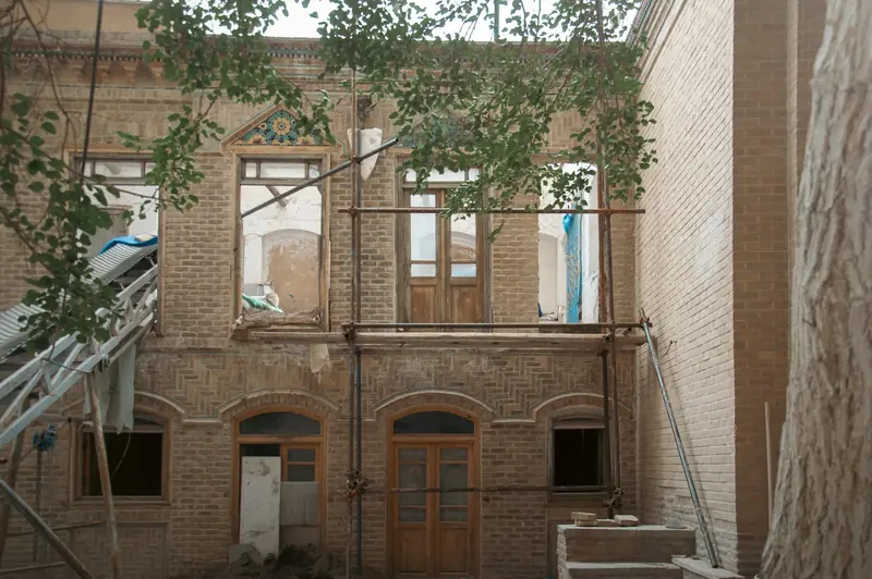 Old brick building stripped back with empty window openings