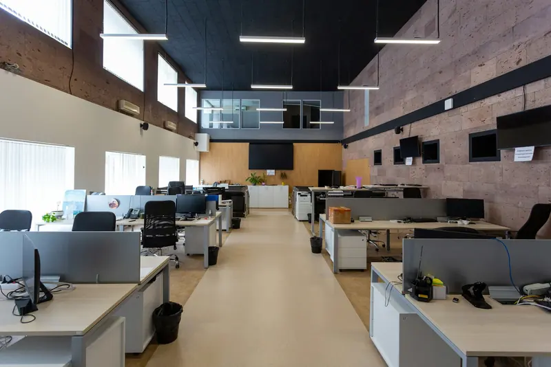 Open-plan office with linear lighting over the desks
