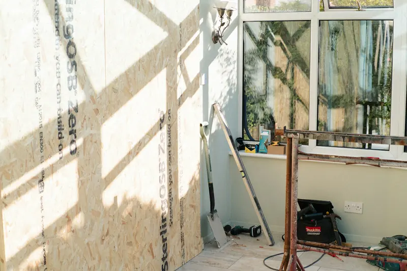 OSB-lined room under construction in sunlight