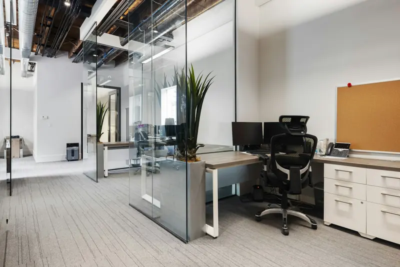 Private office with desk and glass partition
