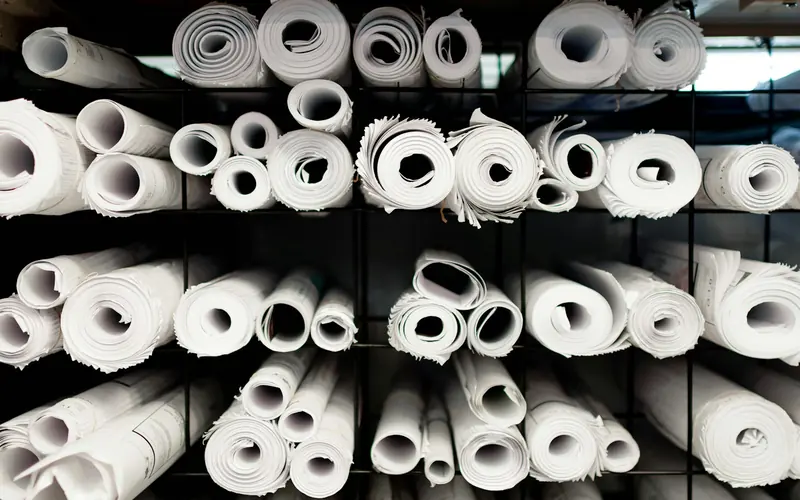 Shelves of rolled-up drawings in a design office