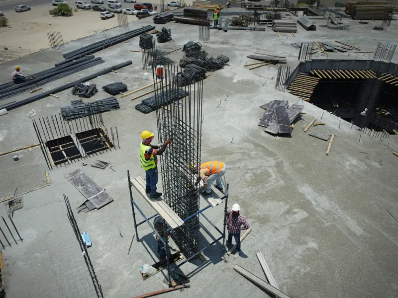 Site team working on a concrete frame seen from above