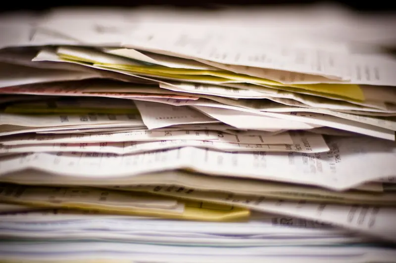 Thick stack of invoices and receipts