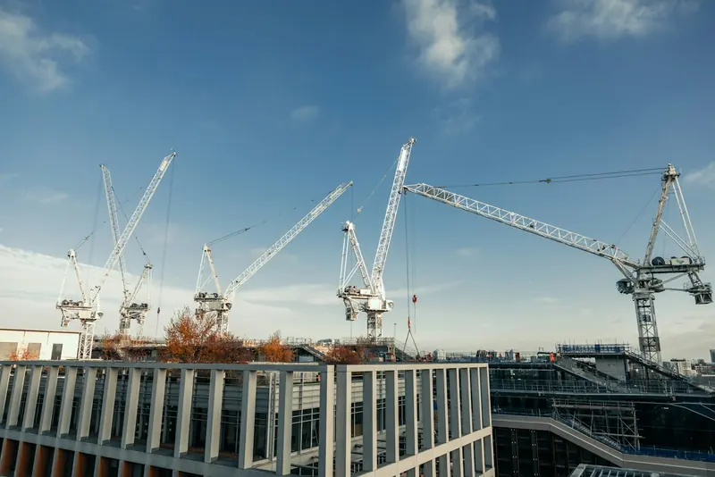 Tower cranes over a city construction site