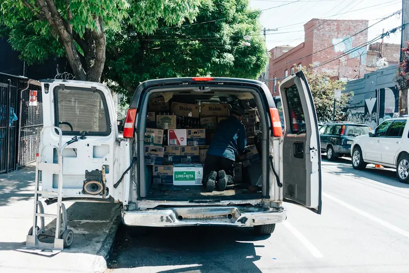 Van with doors open and tools racked inside