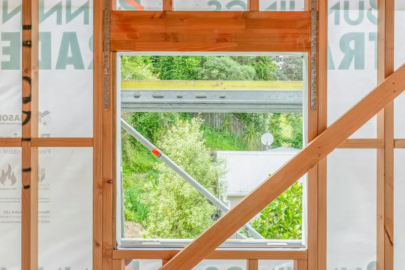 View through a new timber window frame on a building site