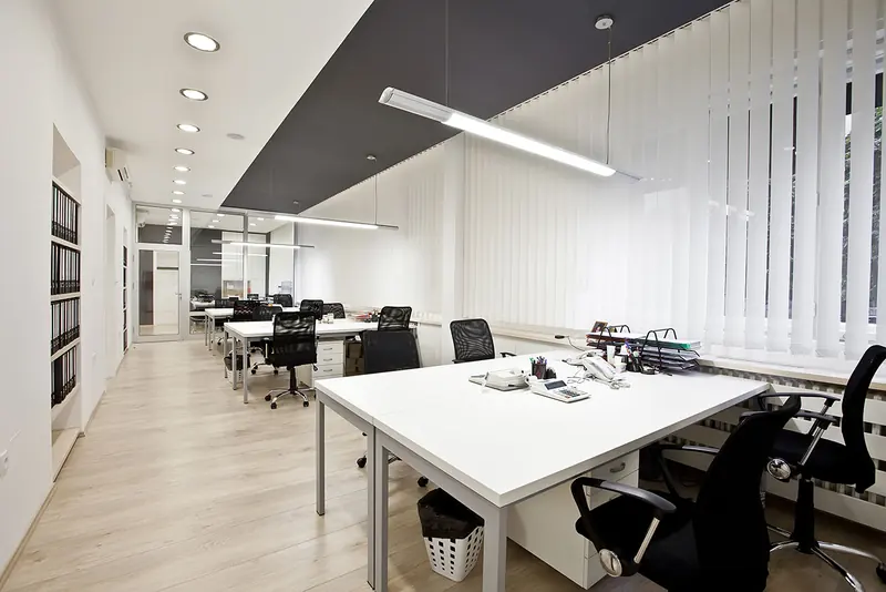 Bright white office with long desks after a Craftex fit-out